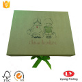 Flat foldable cardboard gift box with ribbon